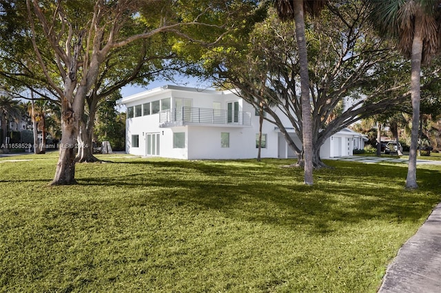 view of side of home with a lawn