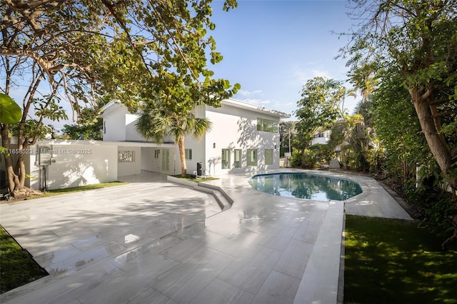 outdoor pool featuring a patio