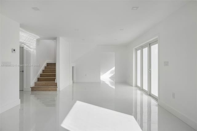 interior space with marble finish floor and stairway