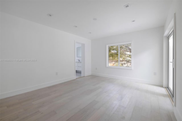 spare room with light hardwood / wood-style flooring