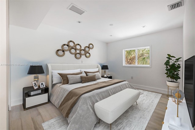 bedroom with light hardwood / wood-style floors