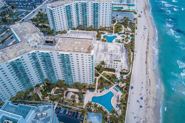 birds eye view of property featuring a view of the beach and a water view