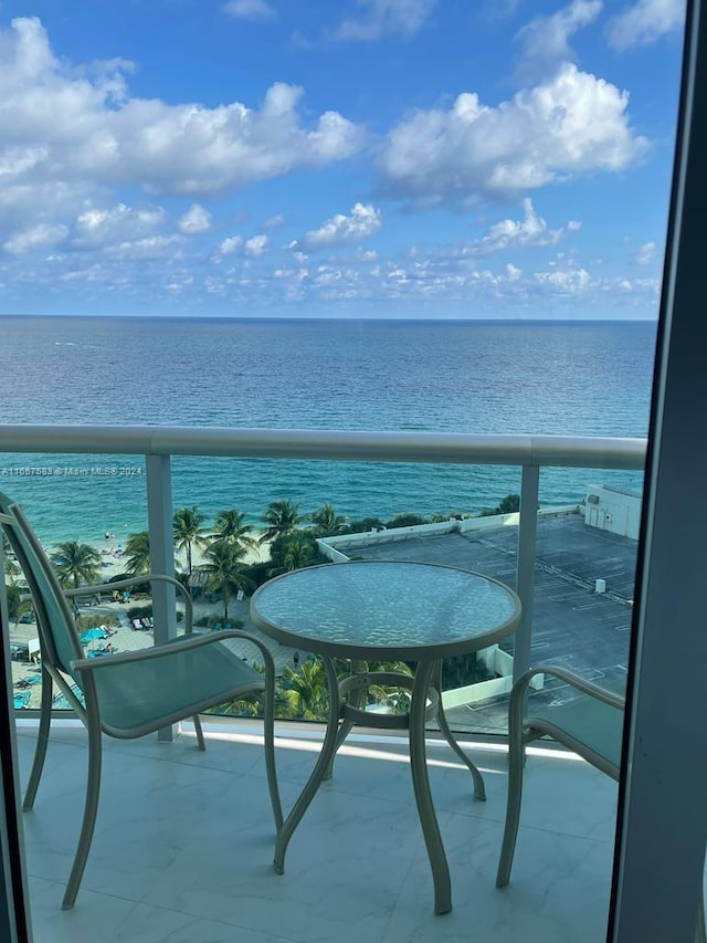 balcony featuring a water view