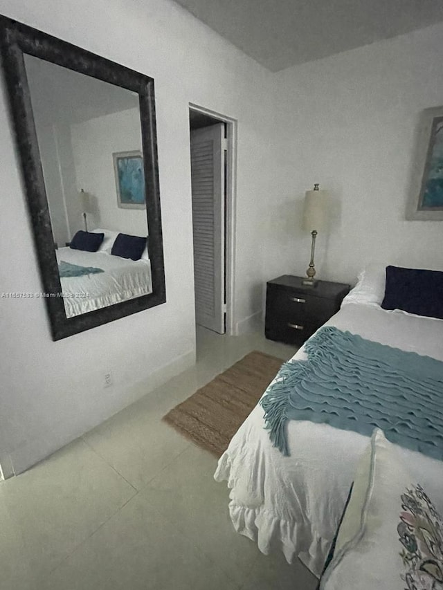3801 S Ocean Dr Unit 12M, Hollywood, FL 33019 - bedroom with tile patterned floors