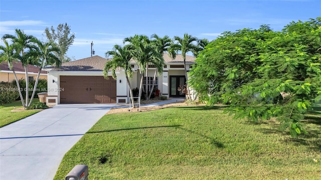 view of front facade featuring a front yard and a garage