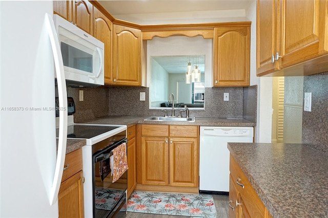 kitchen with tasteful backsplash, sink, white appliances, and light hardwood / wood-style flooring