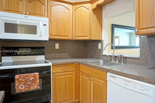 kitchen with tasteful backsplash, white appliances, and sink