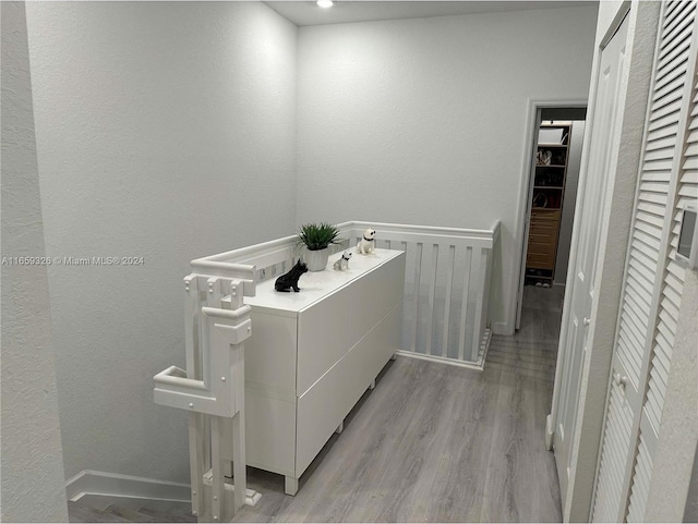 bathroom with hardwood / wood-style floors