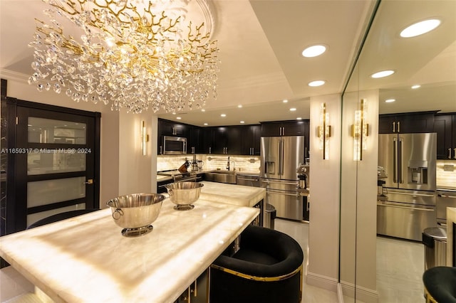 dining area with crown molding and sink