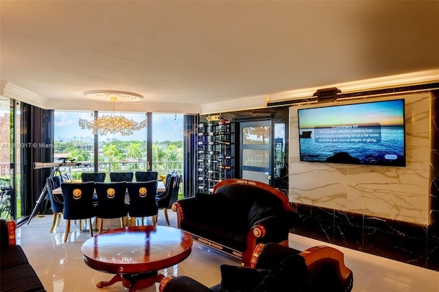 tiled living room featuring plenty of natural light and a notable chandelier