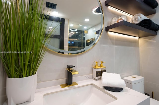 bathroom featuring vanity and toilet