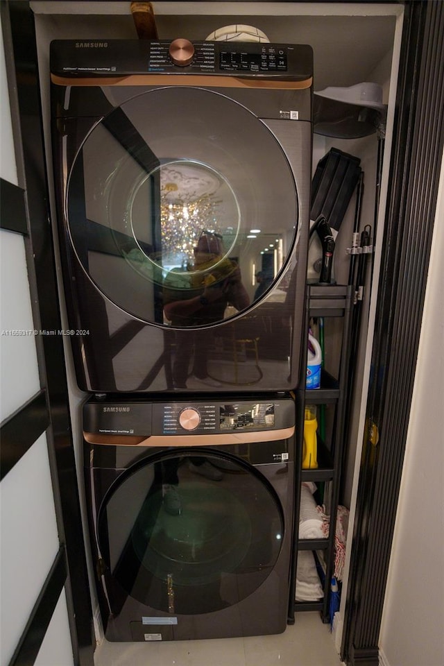 washroom with stacked washer / drying machine