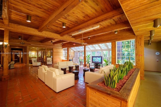 living room with ceiling fan, wood ceiling, and beamed ceiling