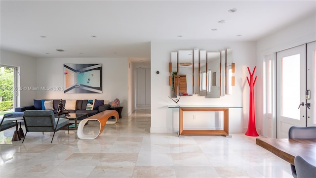 living area with recessed lighting and french doors