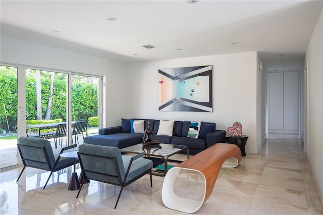 living area featuring marble finish floor, baseboards, visible vents, and recessed lighting