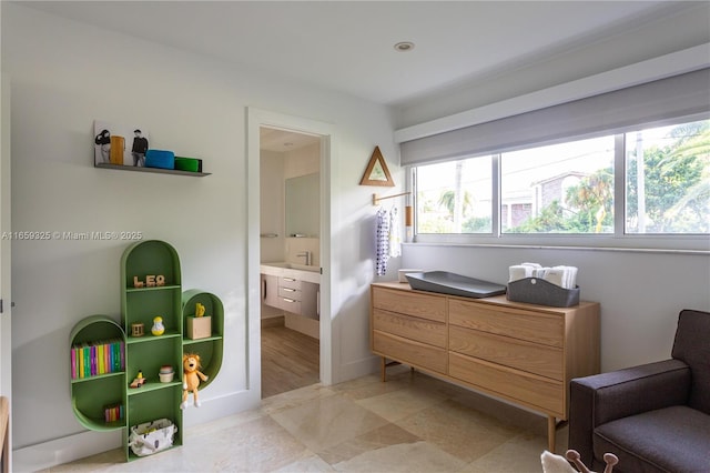 interior space with vanity and baseboards