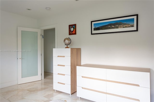 hallway with marble finish floor