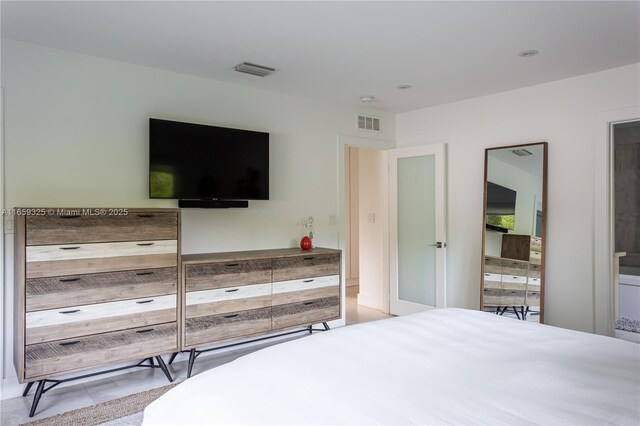 bedroom featuring light tile patterned flooring