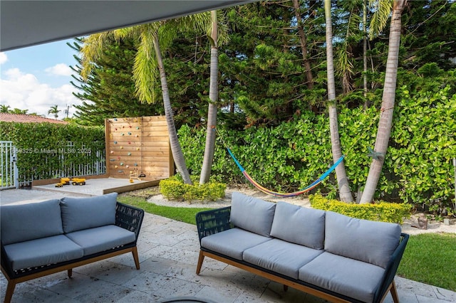 view of patio with fence and an outdoor hangout area