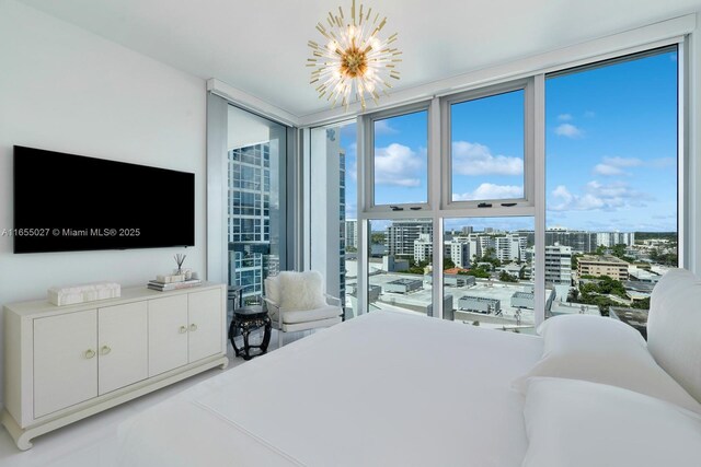 bedroom featuring a notable chandelier