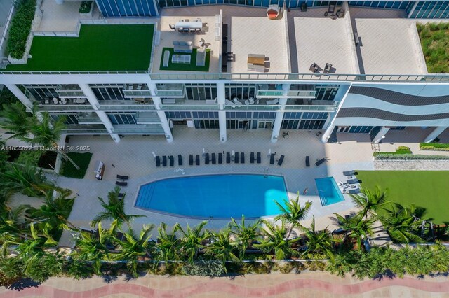 bird's eye view featuring a beach view and a water view