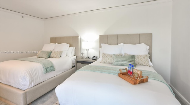 bedroom featuring crown molding