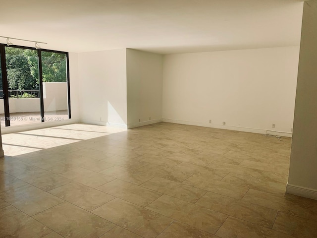 empty room with floor to ceiling windows