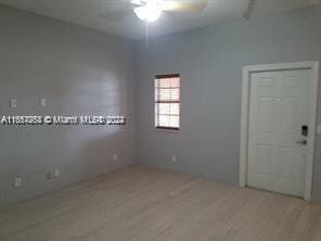 unfurnished room featuring ceiling fan and light hardwood / wood-style floors