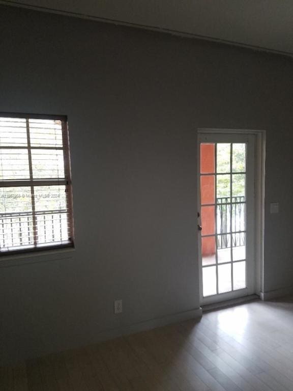 unfurnished room featuring wood-type flooring