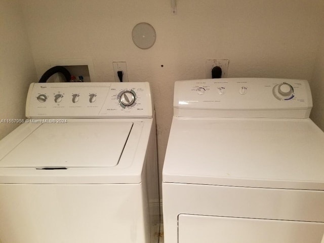 washroom featuring washer and clothes dryer