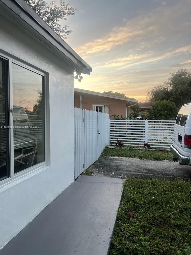 view of property exterior at dusk