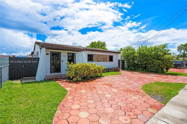 view of front of home with a front lawn