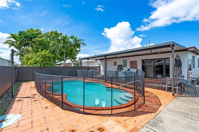 view of swimming pool featuring a patio area and ceiling fan