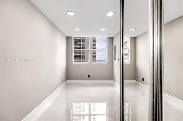 empty room with light tile patterned flooring