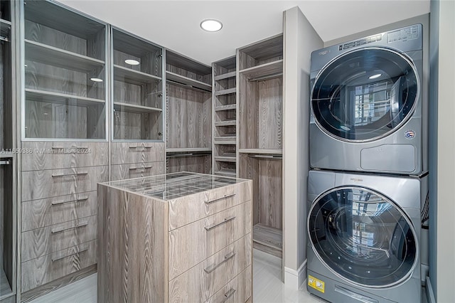 laundry area with stacked washer / drying machine