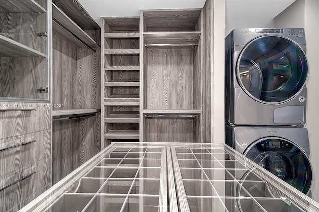 clothes washing area featuring stacked washer / drying machine