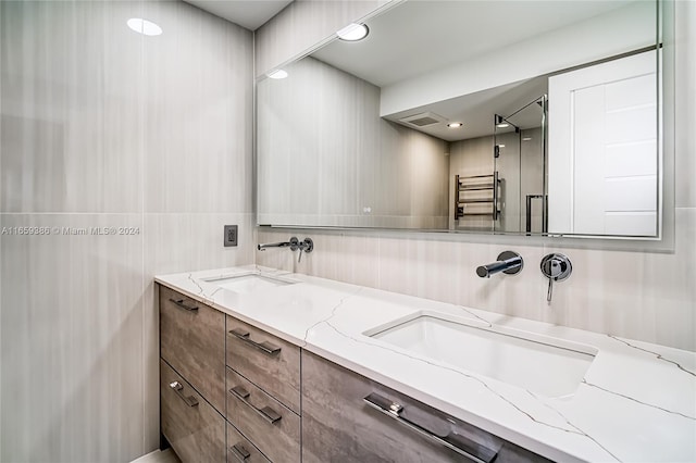 bathroom with radiator and vanity