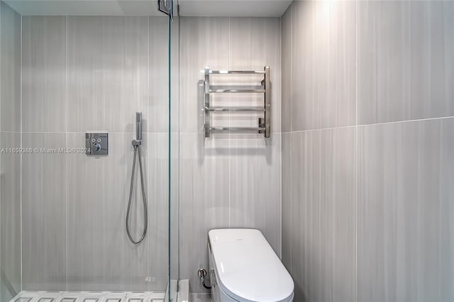 bathroom featuring walk in shower and toilet