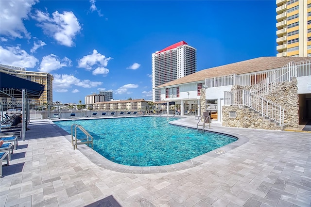 view of swimming pool featuring a patio