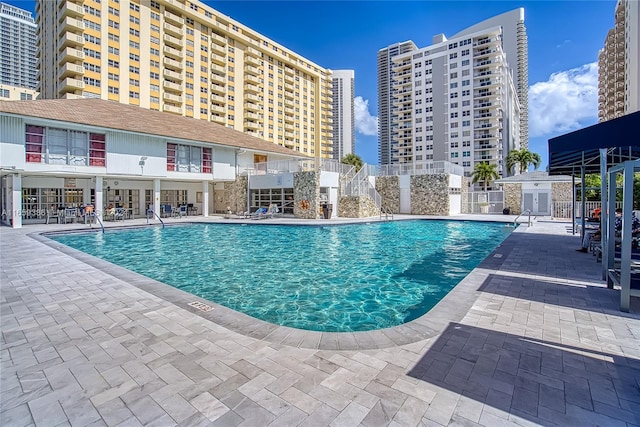 view of swimming pool featuring a patio area