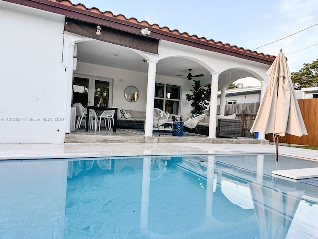 view of pool featuring an outdoor hangout area, ceiling fan, and a patio