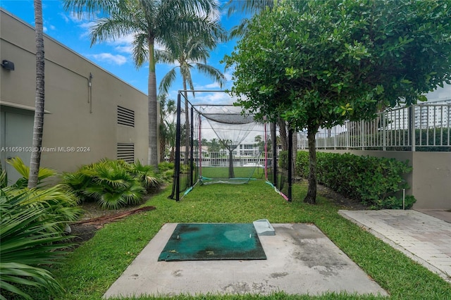 view of property's community featuring a yard