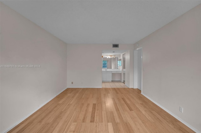 spare room featuring light hardwood / wood-style floors