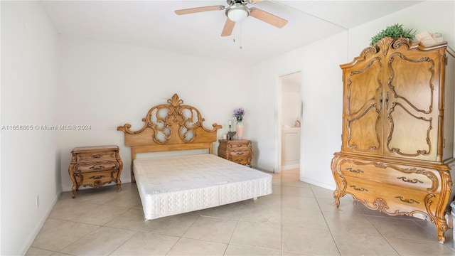 tiled bedroom featuring ceiling fan