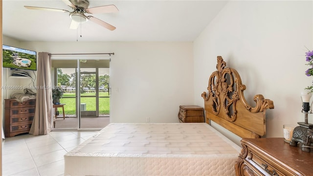 tiled bedroom with ceiling fan and access to exterior