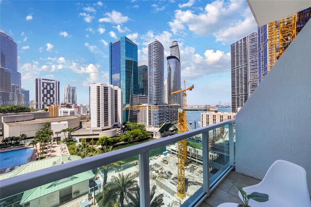 balcony featuring a water view