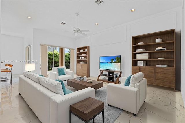 living room featuring ceiling fan and built in features