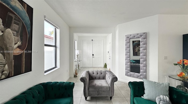 tiled living room with a textured ceiling