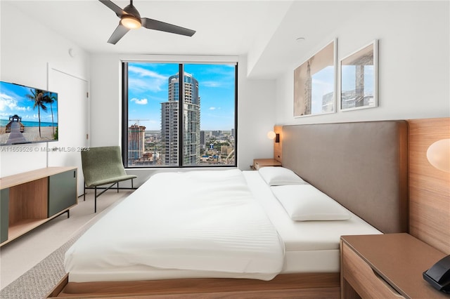 bedroom with hardwood / wood-style floors and ceiling fan