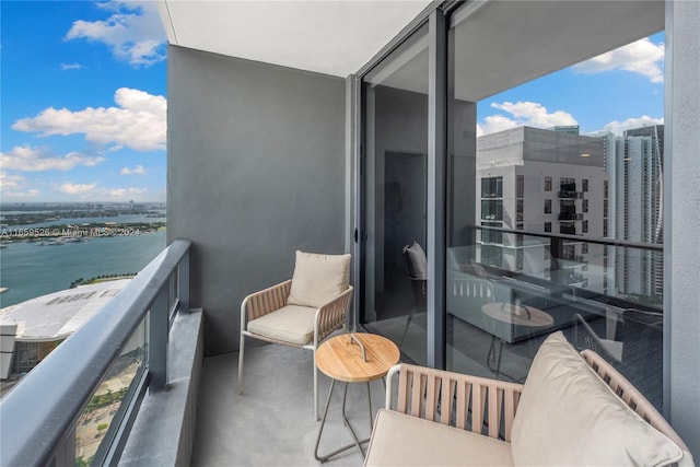 balcony featuring a water view